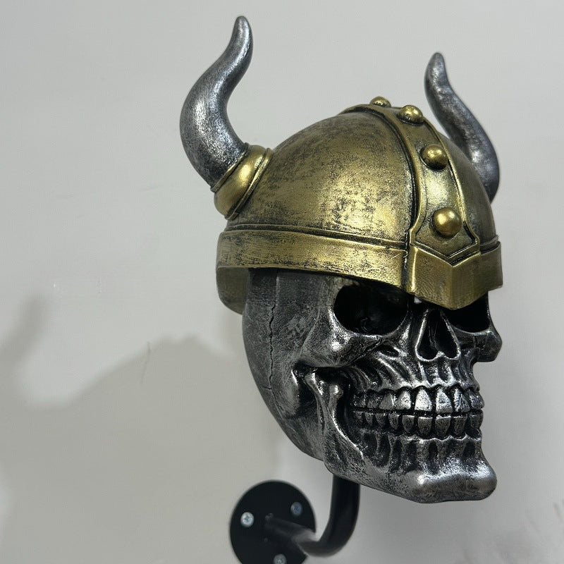 Decorative helmet holder with skull made of synthetic resin