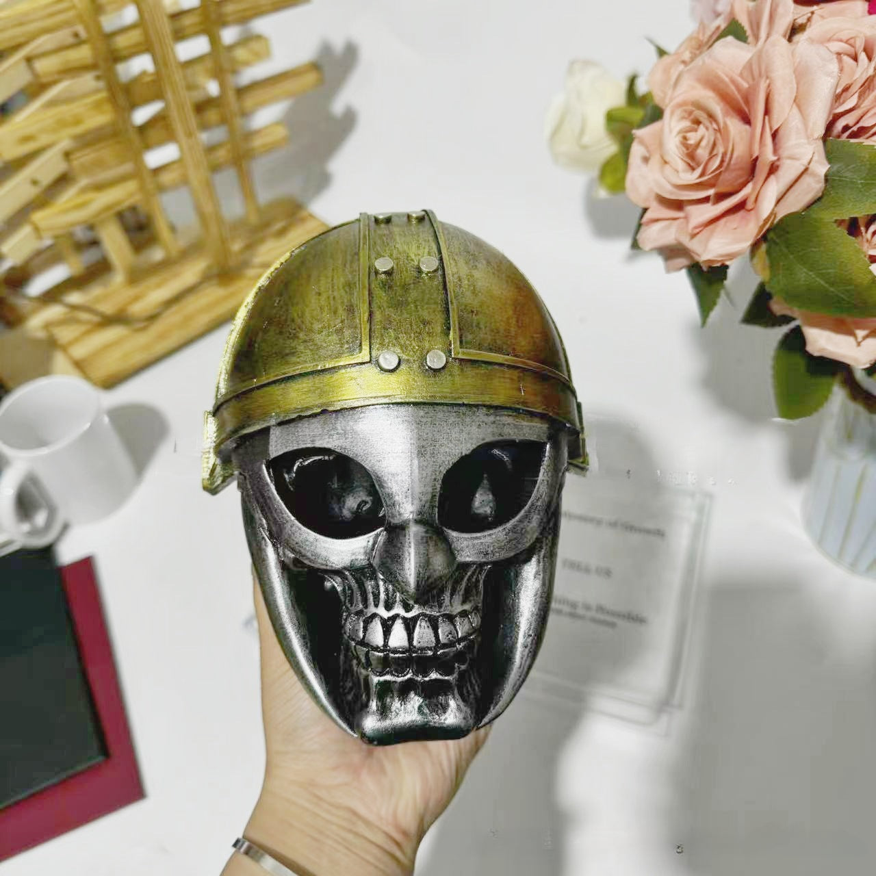 Decorative helmet holder with skull made of synthetic resin